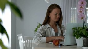 Young woman working from home on laptop, shout to family to give her time. Remote work stress, work-life balance challenge, multitasking at home, working mother, freelance lifestyle in cozy interior. - Powered by Shutterstock - Get 15% off with code: PIKWIZARD15