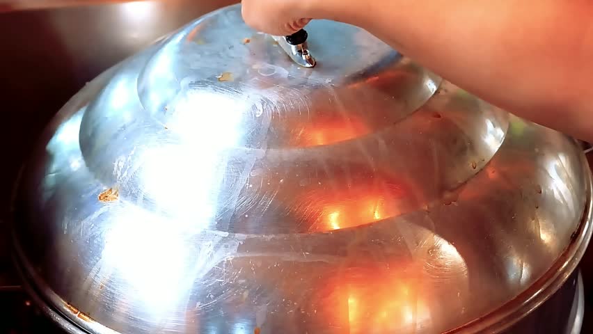 A giant rock lobster is steamed and later BBQ grilled with herbs and garlic butter. The shell turns golden as smoke rises, creating an authentic gourmet seafood experience and chef special dish.