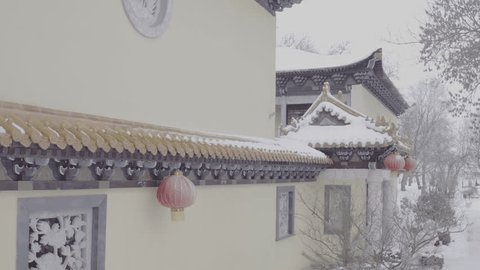 Drone Flying along Snowy Roof Chinese Temple