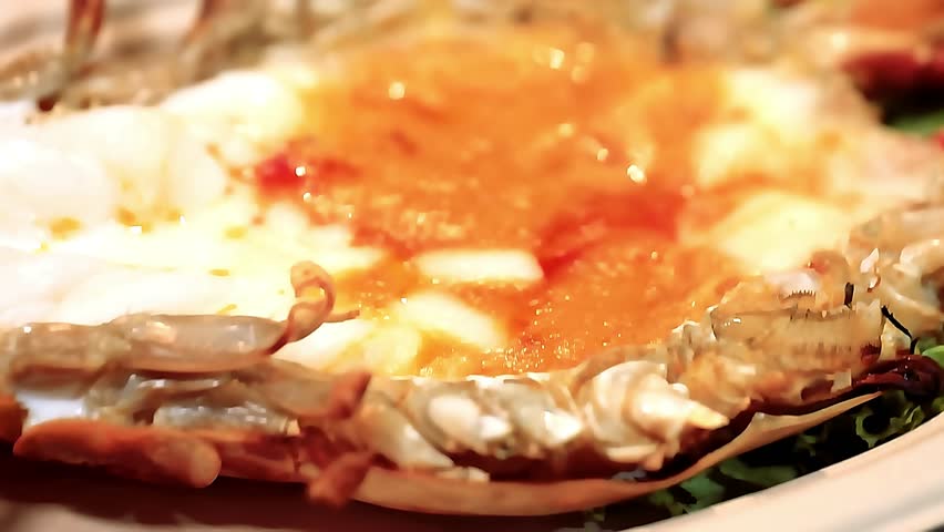 King giant prawns grilled - large juicy prawns barbecued over open flame with smoky butter glaze. The chef grills them to golden perfection, capturing sizzling texture, luxurious seafood delicacy food