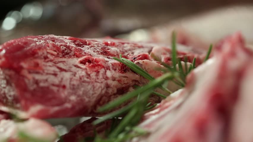 Dynamic close-up of fresh, raw lamb ribs, showcasing high-quality, bone-in meat. Perfect for gourmet cooking, culinary projects, food blogs, or butcher shop promotions. Highlighting healthy protein.
