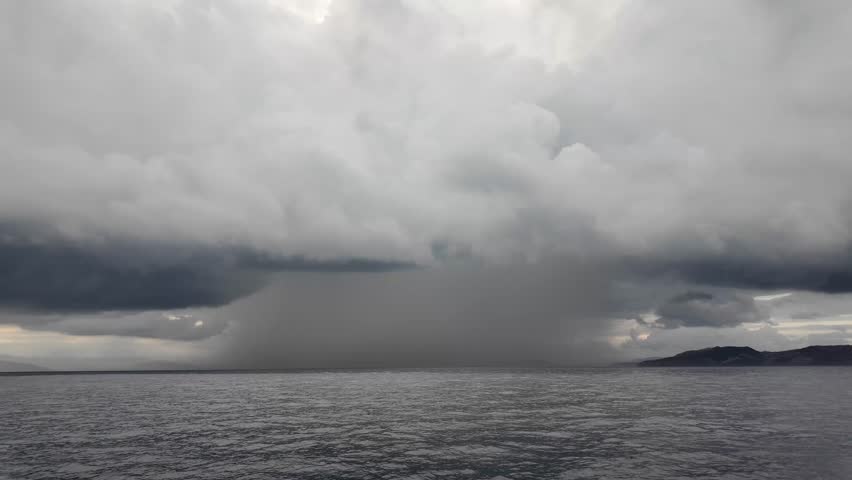 Heavy rain falls on a region in the Aegean Sea before a storm