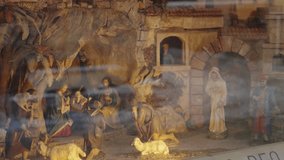 Display of miniature diorama of nativity scene in Christianity religion. Bible related scene and themes with handcrafted artworks for Christmas season and New Year in cold street during winter holiday - Powered by Shutterstock - Get 15% off with code: PIKWIZARD15
