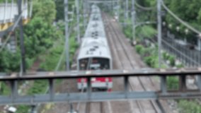 Pulled over at the descended pole barrier at the railroad intersection looking at the railway tracks and a loaded freight train passing by shipping bulk, oil in tanks and heavy cargo and passenger - Powered by Shutterstock - Get 15% off with code: PIKWIZARD15