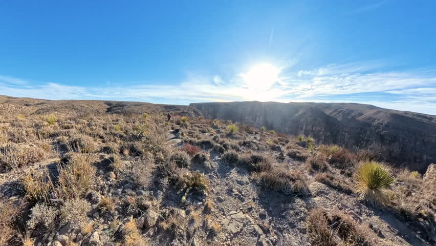 Man Hikes Along Edge of Mariscal Canyon in Big Bend National Park

