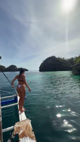 girl jumping in water, Beach view, waterfall and sea, Summer vacation and travel concept