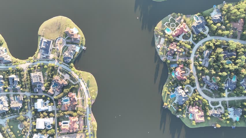 Aerial view of luxurious houses with swimming pools by Woodlands lake, Houston, Texas, America 