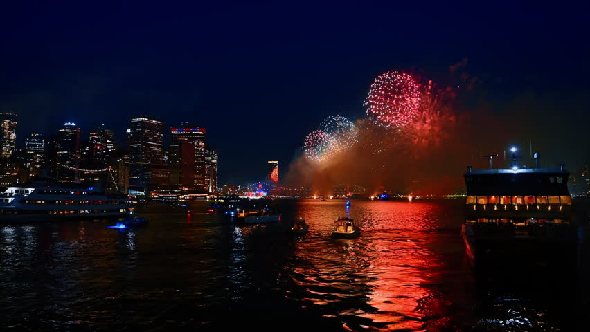 Beautiful fireworks at night over the East River. New York celebrates the 4th of July. View from the boat.
