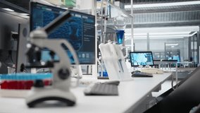 Close up of microscope in lab next to computer monitor displaying DNA data and molecular analysis interface in laboratory. Bioinformatics genomics software on PC and optical device in sterile lab - Powered by Shutterstock - Get 15% off with code: PIKWIZARD15