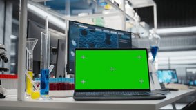 Isolated screen laptop in lab next to test tubes and microscope equipment. Mockup notebook in laboratory used to study DNA strand mapping with genomics analysis program, zoom out shot - Powered by Shutterstock - Get 15% off with code: PIKWIZARD15