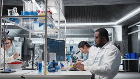 Medical technician investigates chemical sample properties using PC software in sterile laboratory setting. Research facility expert analyzing vial containing new compound using computer, camera A - Powered by Shutterstock - Get 15% off with code: PIKWIZARD15