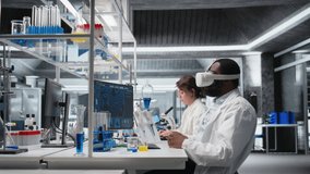 Scientist using computer and VR headset equipment for DNA data analysis in laboratory. African american man using bioinformatics genomics software and virtual reality tech in modern lab, camera A - Powered by Shutterstock - Get 15% off with code: PIKWIZARD15