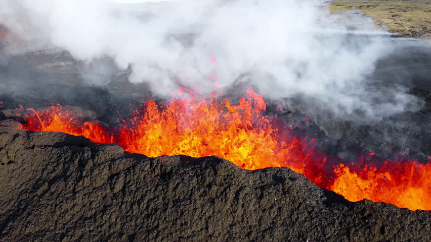 Volcano Eruption, Flowing Red Hot Lava Erupts from Crater, Iceland