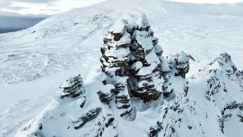 Steep peak covered in snow, Snowy mountain range, Aerial view nature landscape in Iceland, Epic panorama, Nature summit