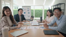 Diverse Group young adult Gen Z asia people work happy smile laugh look at POV camera screen at table desk office workplace board room video call. Success male female asian white collar labor ESG day. - Powered by Shutterstock - Get 15% off with code: PIKWIZARD15