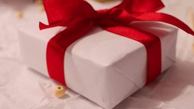 Close up 4k footage of homemade christmas gift with red ribbon .Christmas or Birthday present .Slow vertical movement - Powered by Shutterstock - Get 15% off with code: PIKWIZARD15