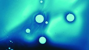 Spreading blob. Paint spot. Defocused blue neon water liquid essence drop neon ink dark black flow pour on abstract light background. - Powered by Shutterstock - Get 15% off with code: PIKWIZARD15