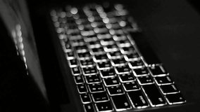 Hands typing on a glowing laptop keyboard in the dark creating digital content - Powered by Shutterstock - Get 15% off with code: PIKWIZARD15