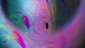 Vertical video. Spectrum defocused ink. Colorful paint planet. Oil soap liquid iridescent flow round lens frame. Dye orbit cosmic black background. - Powered by Shutterstock - Get 15% off with code: PIKWIZARD15