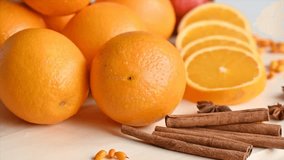 Close-up of an orange composition with sea buckthorn berries and cinnamon sticks, highlighting natural textures, colors, and seasonal ingredients. - Powered by Shutterstock - Get 15% off with code: PIKWIZARD15