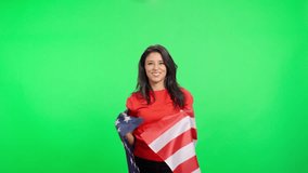 Patriotic american woman waving a United States flag on green screen - Powered by Shutterstock - Get 15% off with code: PIKWIZARD15