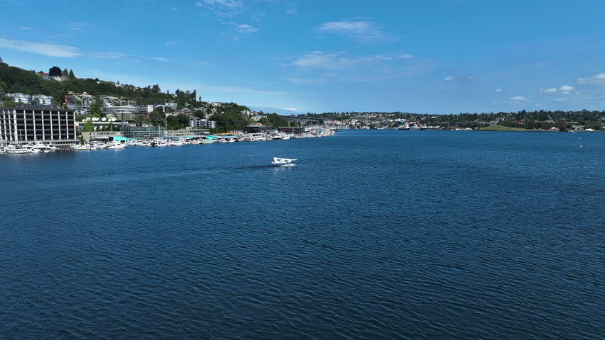 Aerial view following a seaplane landing on Lake Union, sunny day in Seattle