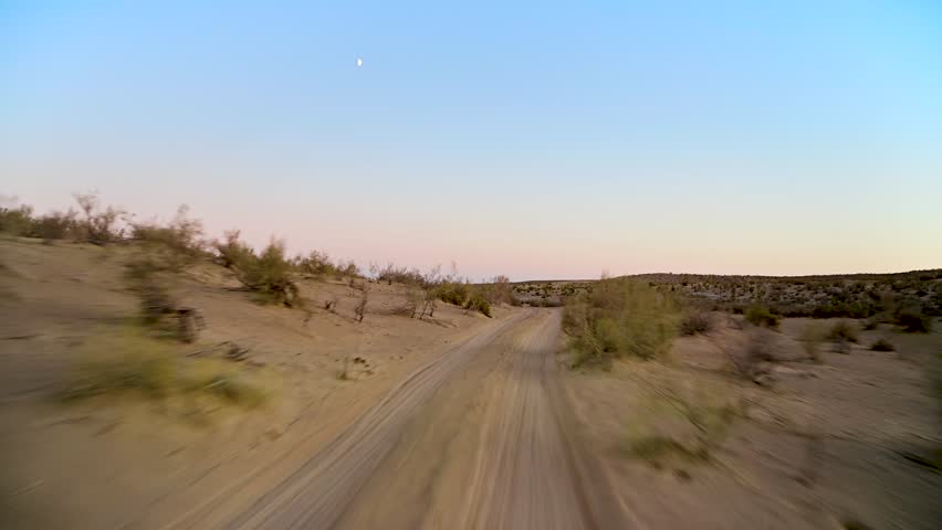 Driving through the Karakum Desert in the late afternoon in Turkmenistan