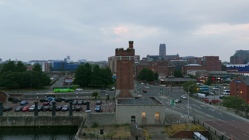 Wapping Dock and brick tower, Liverpool, UK. Aerial drone orbiting
