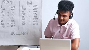 Cheerfull Young teacher explaining English grammar tenses online with whiteboard and laptop - Powered by Shutterstock - Get 15% off with code: PIKWIZARD15