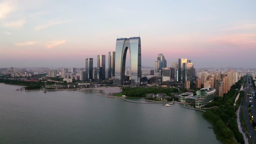 CBD buildings by the lake. Aerial in Suzhou, China 4k