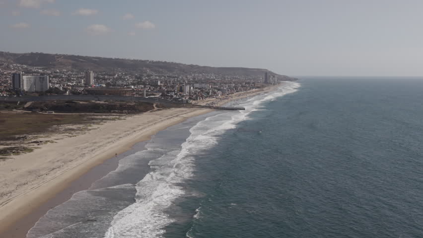 Playas de Tijuana, Baja California, aerial drone video showing separation of USA and Mexico.