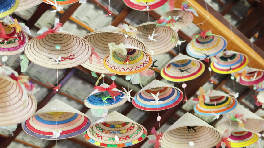 Garlands made from Vietnamese national hats are hanging from the ceiling.