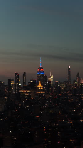 bright city night, empire state building radiates with vibrant illumination during twilight