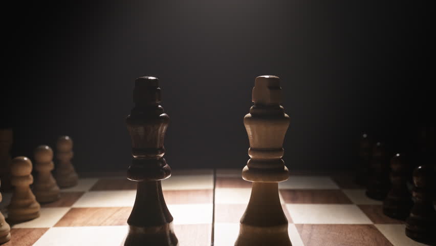 Close-up of Two Kings on Chessboard Against Dark Background Symbolizing Strategy, Tactical Thinking, Leadership, Foresight, Decision-Making, and the Timeless Battle of Minds and Logic