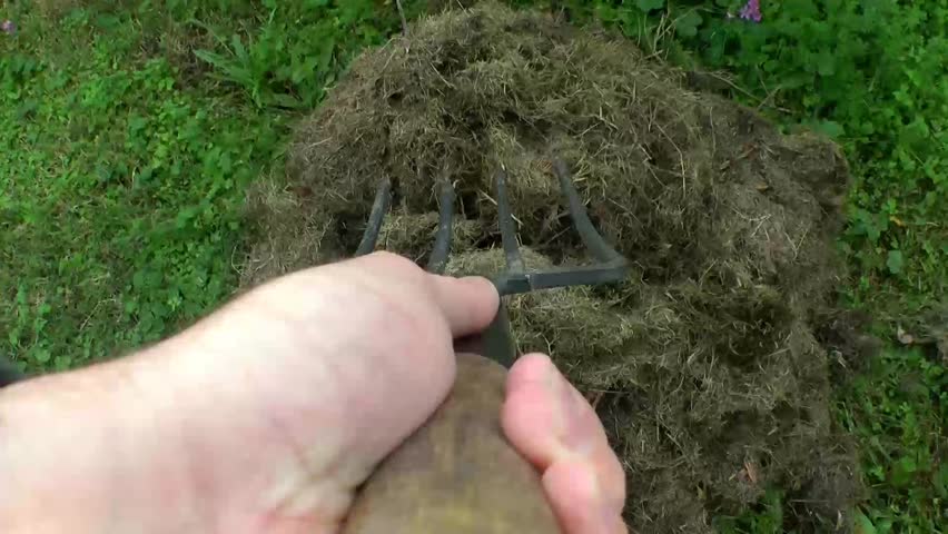 using a pitch fork in the garden pov
