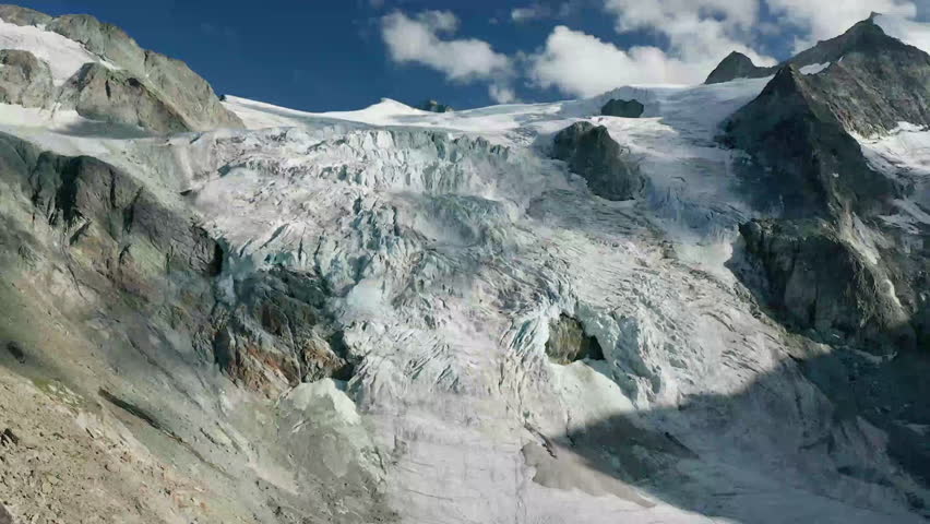 Aerial of mountain landscape with glacier on slope