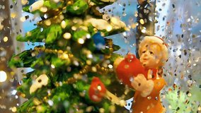 A cute toy boy sitting in a bowl beside a glowing Christmas tree, as colorful sprinkles shower around him. Festive holiday magic, cozy vibes, and joyful Christmas celebration atmosphere. - Powered by Shutterstock - Get 15% off with code: PIKWIZARD15