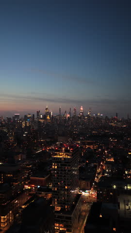 dusk cityscape overview, nightfall unveils glowing metropolis with busy streets and towering