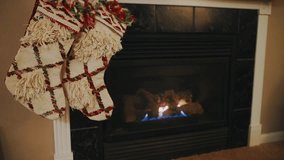  Festive Christmas stockings hung next to a warm, crackling fireplace. The perfect image of cozy holiday tradition, warmth, and the anticipation of Christmas morning. - Powered by Shutterstock - Get 15% off with code: PIKWIZARD15