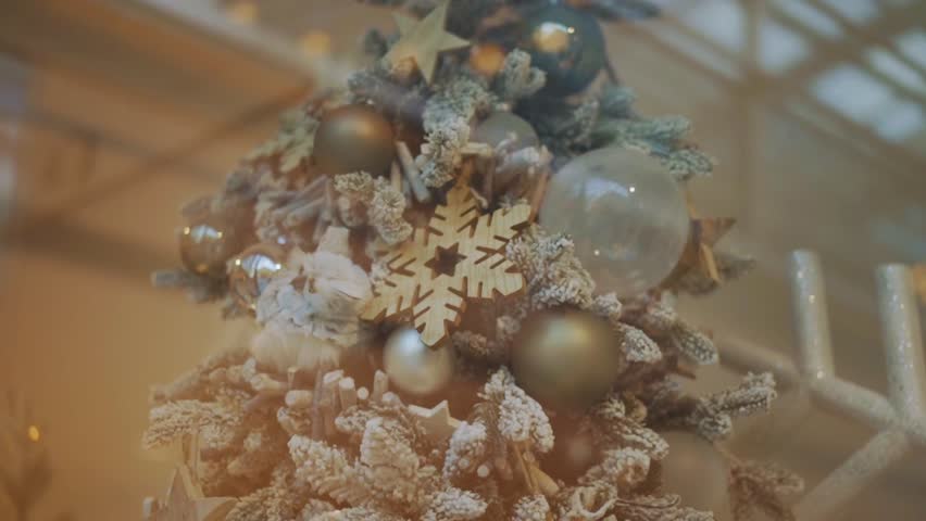 A beautifully decorated Christmas tree adorned with delicate snowflake ornaments. This festive decoration captures the magical and frosty spirit of a winter holiday. - Powered by Shutterstock - Get 15% off with code: PIKWIZARD15