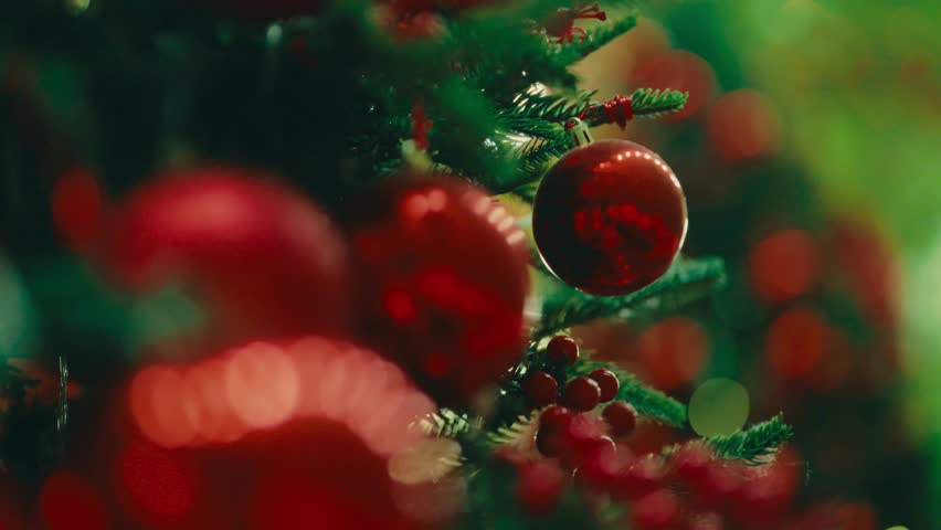  A classic Christmas concept: a closeup shot of a festive tree decorated with vibrant red Christmas balls. Perfect for holiday marketing and backgrounds.