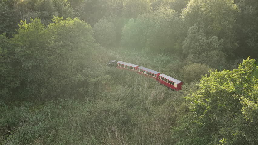 Aerial view tracking a train at Oakfield Park in Donegal Ireland