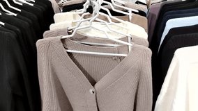 Capsule wardrobe and quiet luxury neutral knit sweaters on rack camera movement useful for lookbooks seasonal edits and 2025 trend content - Powered by Shutterstock - Get 15% off with code: PIKWIZARD15