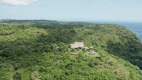 Stunning aerial drone view of Amok Sunset, a popular sunset point perched high on a cliff in Nusa Penida, Bali, Indonesia. - Powered by Shutterstock - Get 15% off with code: PIKWIZARD15
