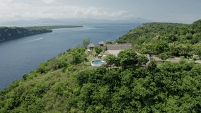 Stunning aerial drone view of Amok Sunset, a popular sunset point perched high on a cliff in Nusa Penida, Bali, Indonesia. - Powered by Shutterstock - Get 15% off with code: PIKWIZARD15