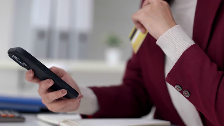 Professional Asian woman realtor discussing housing agreement via remote video conference. She explains real estate terms with clients virtually.