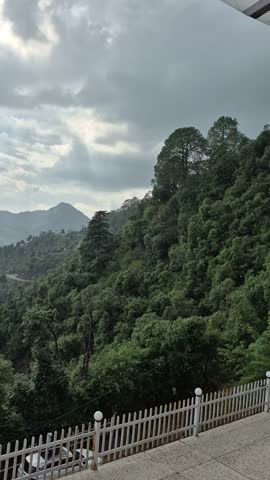 First Monsoon Showers Over the Misty Hills of Mussoorie, India 
A serene view of the lush green hills of Mussoorie as the first gentle monsoon rain begins to fall over the Himalayan foothills.
