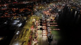 Stunning aerial perspective showing the illuminated mersin international port in turkey at night, capturing the busy container terminal, gantry cranes, and docked cargo ships - Powered by Shutterstock - Get 15% off with code: PIKWIZARD15
