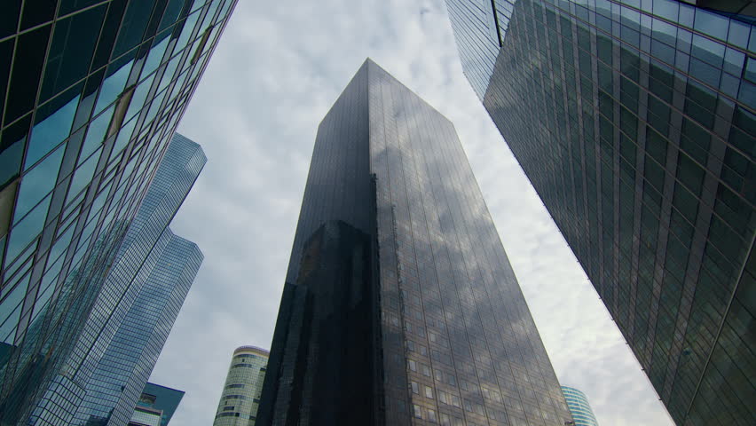 View Looking up at Modern Office Building Architecture in the Financial District. Business and Finance Concept. Timelapse