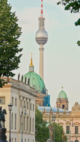 Berlin, Germany - 09.08. 2025: A television tower against the backdrop of a cityscape